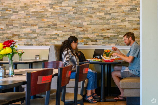 A couple enjoys lunch at Noosh Afghan Cuisine in Delta Township, close to Edgemont Park.