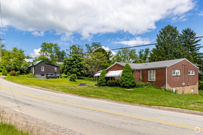 Homes hide between the trees of Frazer Township.