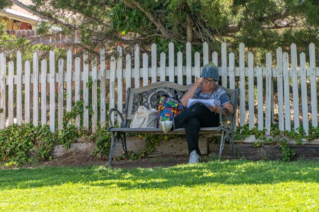 McDuffie Park offers a serene setting for reading, with ample shade and a tranquil atmosphere for Summit Park residents.