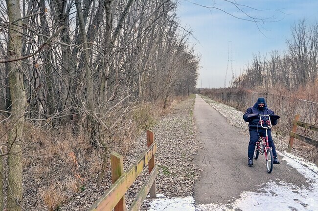 A cyclist braves the cold weather for a bike ride along the Rivergreenway near Lake Forest.