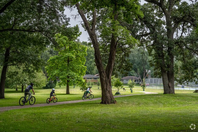 Families take advantage of the bike paths that run through Todd Park.