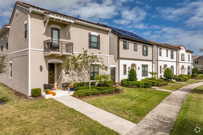 A cozy group of stucco row of homes in the Arrivas Village community.