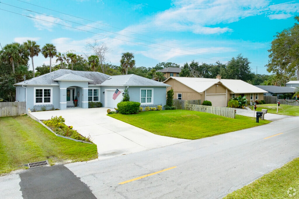 This single family home in the Tomoka Estates area enjoys the breeze from the surrounding Florida palms.