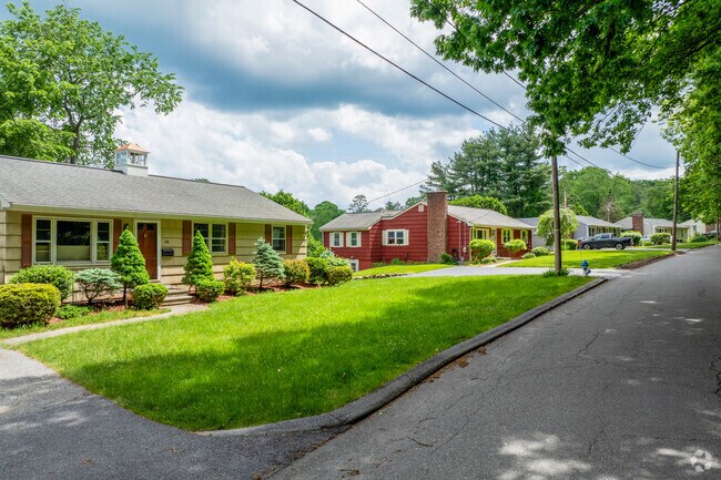 A row of ranch style homes sit along a quiet street in Maynard.