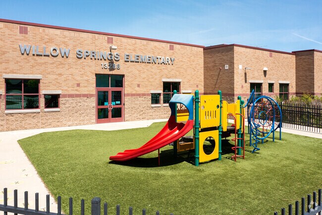 Willow Springs Elementary School's campus features a playground and sports facilities.