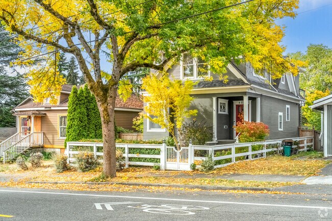 Large trees cover the sidewalks in front of homes in the neighborhood of Atlantic.