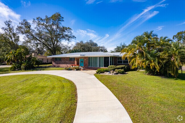 Brick ranch-style homes with brightly painted doors add charm to Lowry Park's residential roads.