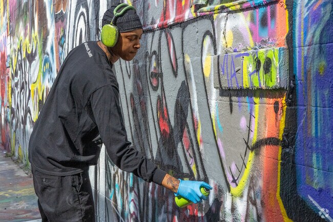 Remington residents head to Graffiti Alley and watch artists like Autumn Saten at work.