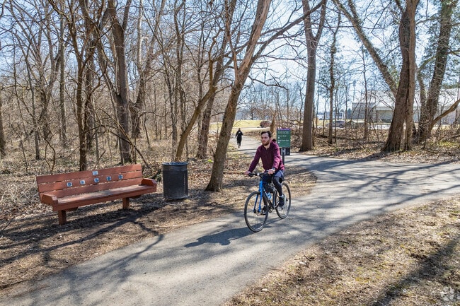 Academy Park entices walkers and bikers alike with paved pathways.