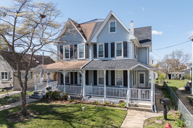 This Riverside Township duplex is reminiscent of the Queen Anne style with its steeply-pitched gables.