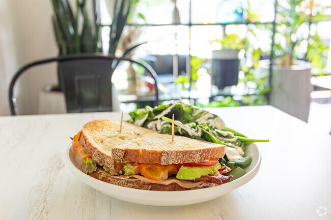 Image locals grab a sandwich for lunch at Hosta Coffee on NE 28th St.