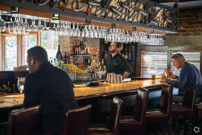 Residents in Paces can grab a seat at the bar at Canoe, serving farm-to-table American cuisine.