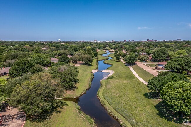 At the neighborhood’s namesake, Duck Creek Linear Park, locals  stroll along the creek.