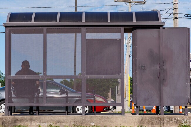 Waiting for the bus in the shade adds to the convenience of public transportation in Oak Grove.