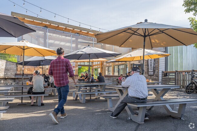Grab a drink outside at Ounces Taproom & Beer Garden in North Delridge.