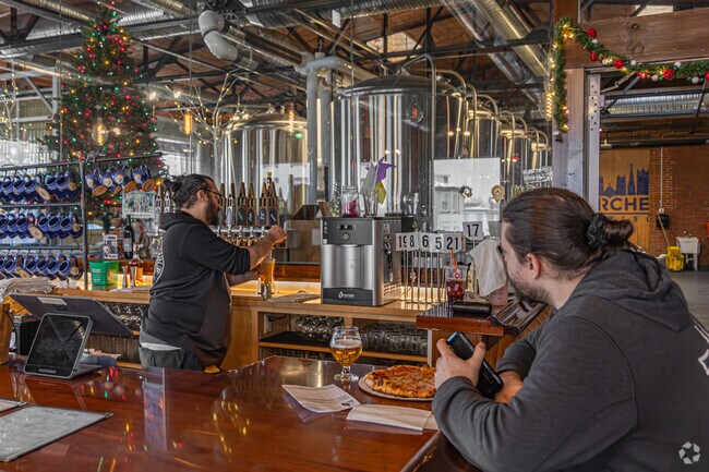 Relax with friends at Five Churches Brewing, a craft beer hub in New Britain.