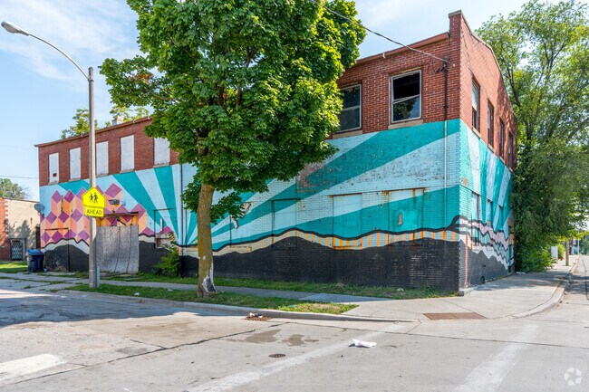 A bright mural covers a building on Lisbon Ave in the  Walnut Hill Neighborhood.