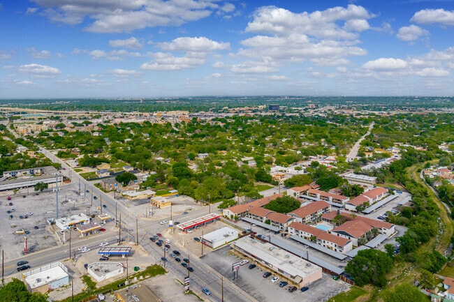 Balcones Heights has shopping around the perimeter with tree filled housing at it's center.