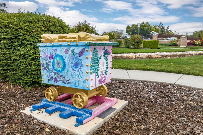 Peter Hill Heritage Park celebrates the railway with a cart of granite statue in Central Rocklin