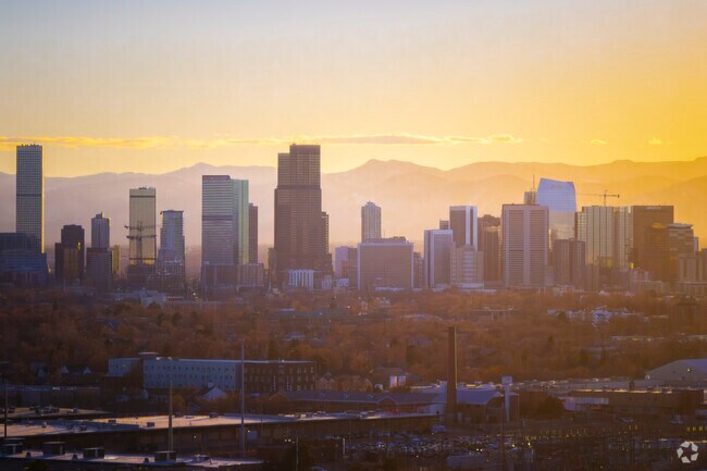 The Denver skyline gleans warm on a winter afternoon in Clayton, CO.