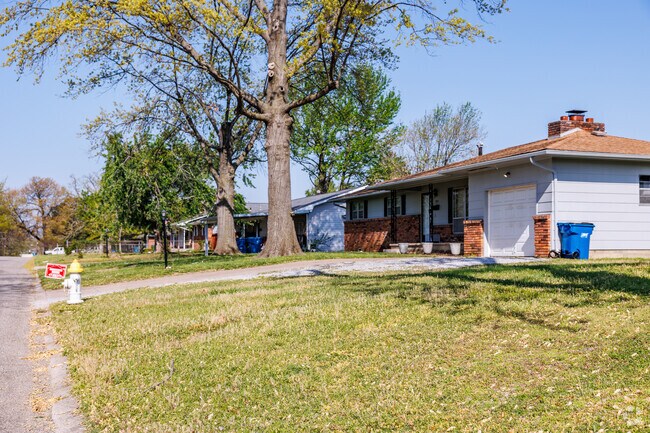 Ranch style homes line a residential street in Park Plaza.