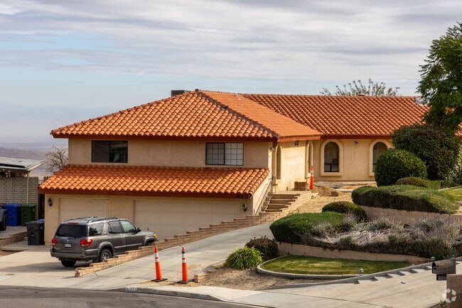 Taft's elegant two-story home boasts a tile-roofed, two-car garage.