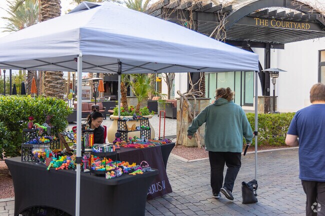 Next to Paradise Hills, the District Farmer's Market welcomes residents to shop local vendors.