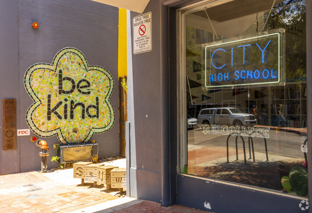 Front shot of school, including more signs & the 