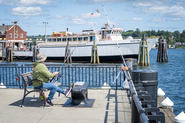 Discover diverse activities, such as fishing, at City Pier in Downtown New London, CT.