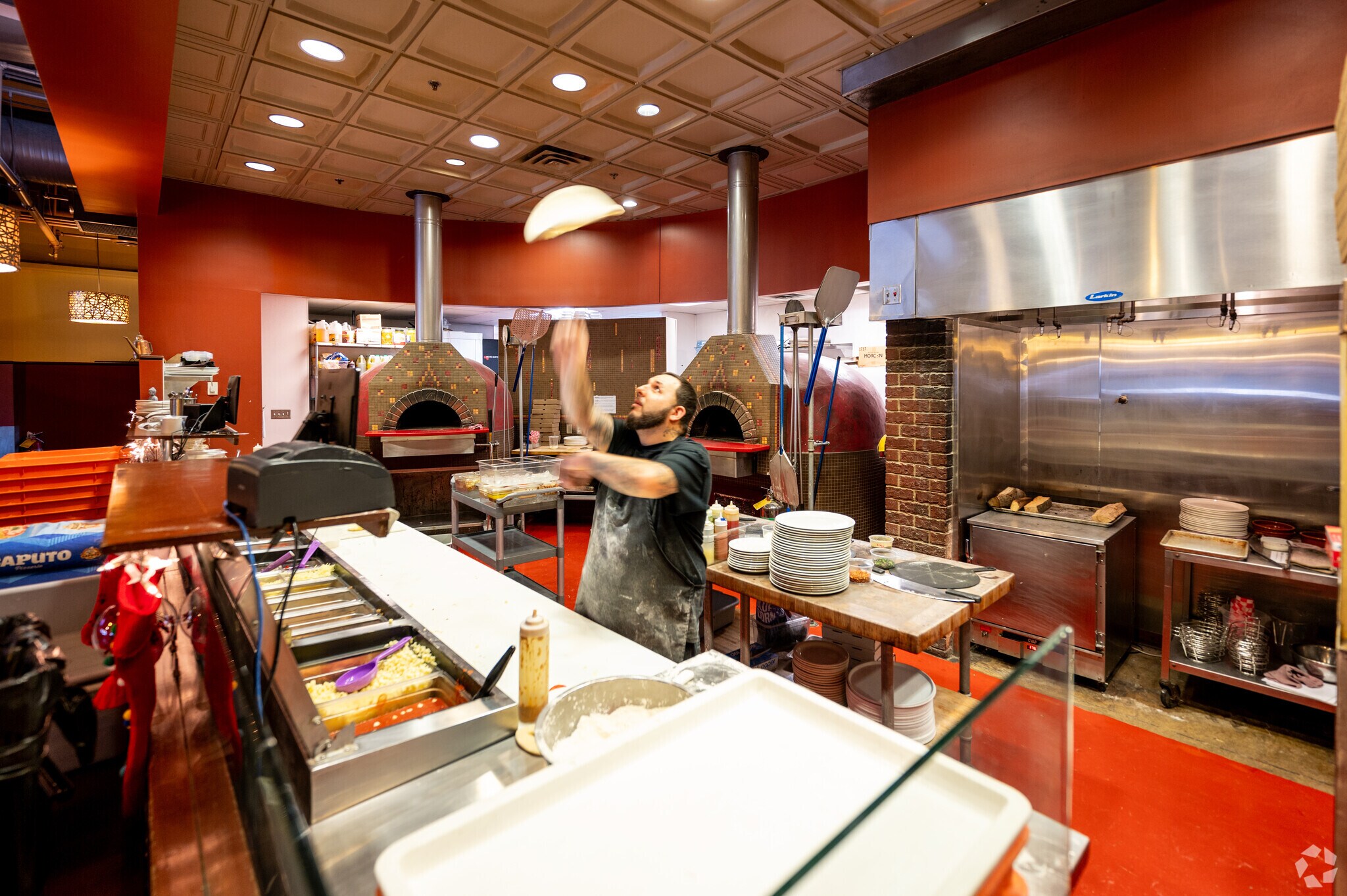 It takes a lot of love to make pizza as good as the pizzaiolo at Three Fires Pizza.