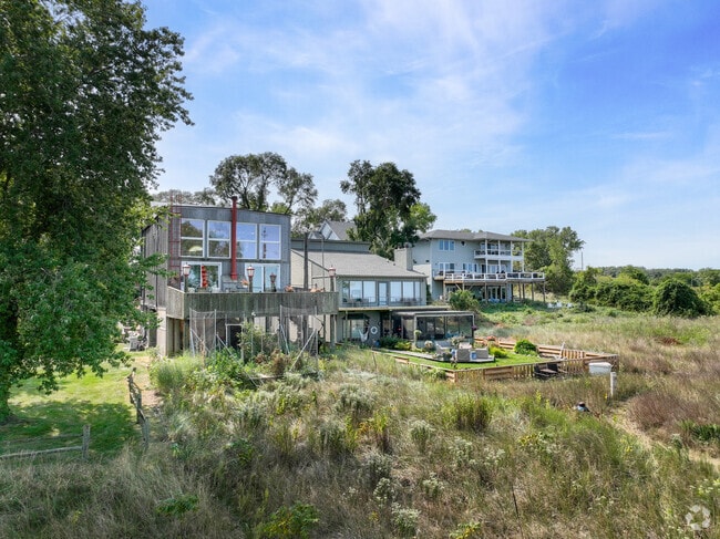 Rows of lakefront homes sit together with unique styles throughout.