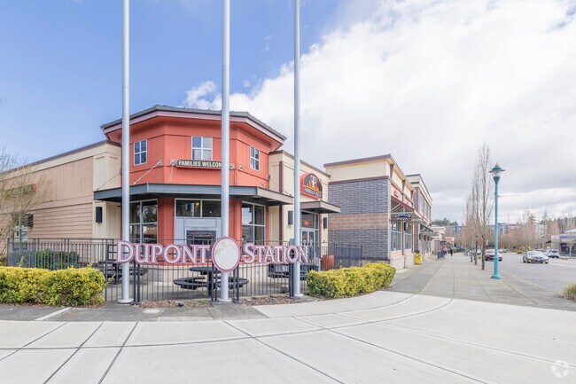 A Dupont Station sign presents it self at the entrance of Downtown Dupont Washington.