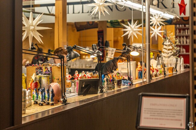 The crafstmen of Vaillancourt Folk Art work on sculptures and art live in house in East Douglas.