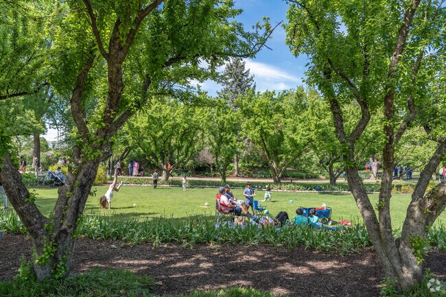 Families will enjoy the green spaces and shade trees in Lilacia Park.