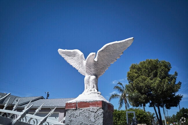Homes in Arleta are unique like this Eagle that adorns a stone fence.
