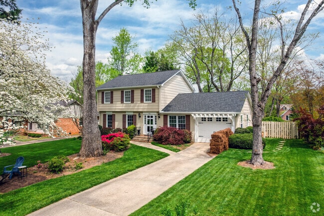 Long driveways and tall trees add to the appeal of Beverly Woods.