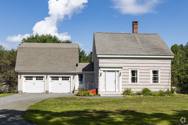 This small Cape with a Gambrel roof garage is typical in West Bath.