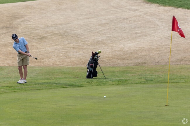 Enjoy a round of golf at the Oxmoor Country Club near Hurstbourne Acres.