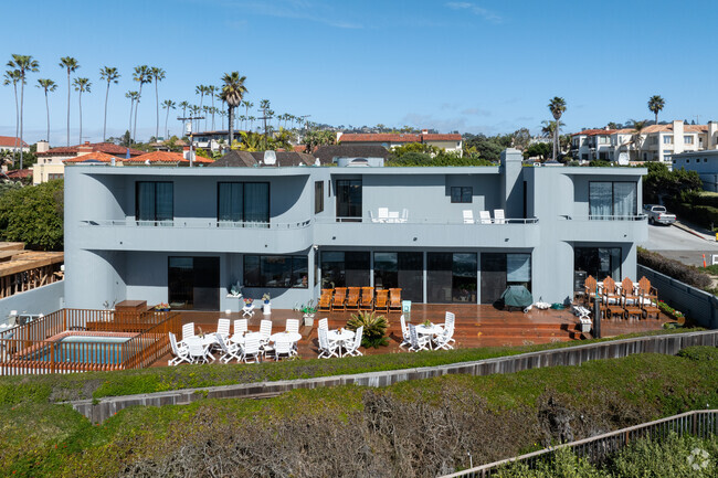 This Hampton style home sits along the ocean cliffs in Beach Barber Tract.