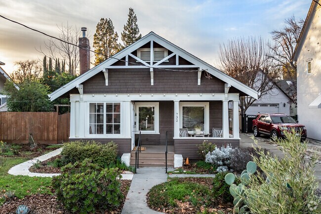 This bungalow cottage is a classic home with shake siding and covered porch in Woodland.
