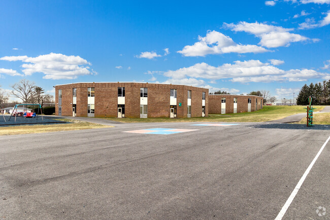 There is a large schoolyard at Pearl S. Buck Elementary School.