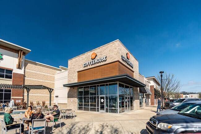 People enjoy sitting on the patio of The Well Coffee House near the Traceside neighborhood.