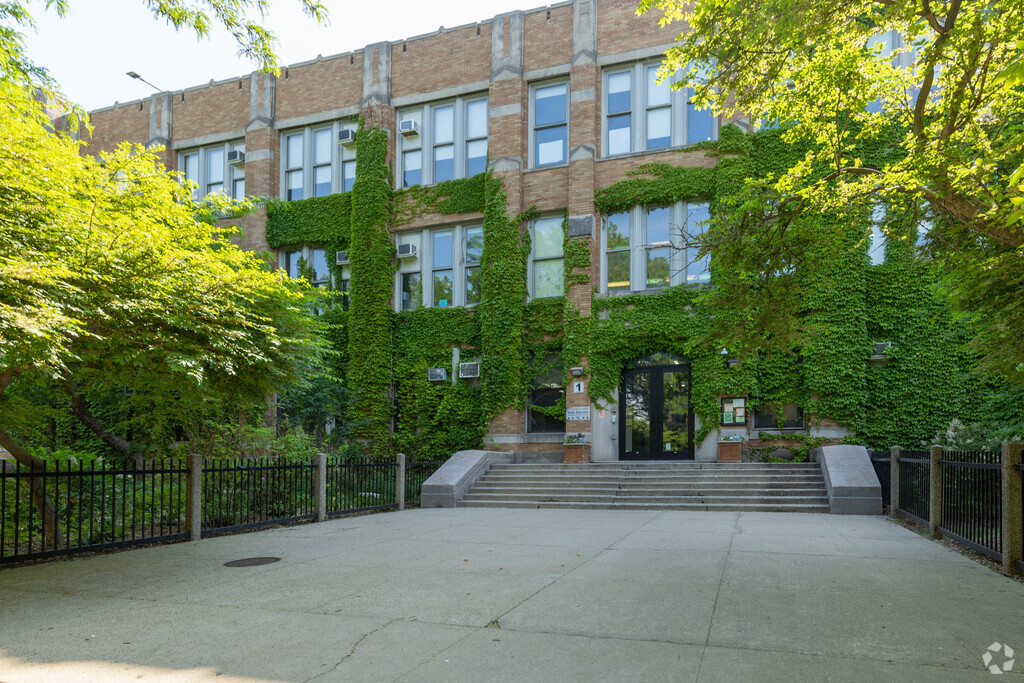 Beautiful ivy covered wide entrance of Alcott College Prep East Campus, Chicago Illinois.