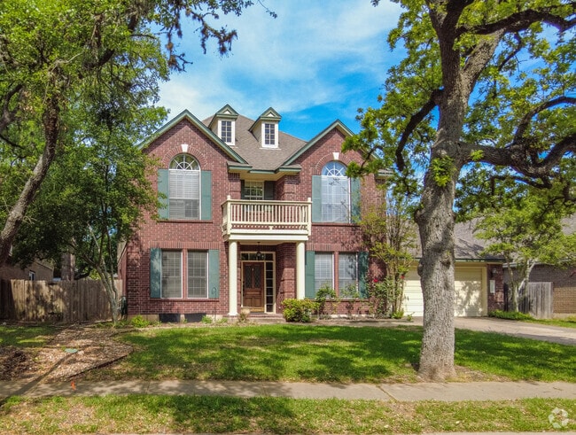 Traditional-style two-story homes are common within the Legend Oaks neighborhood.