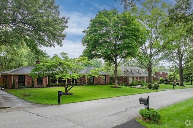 The Riverwood neighborhood streets are lined with mature trees.