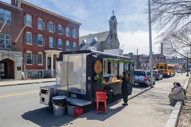 A vibrant food truck near North Common adds to the energy of downtown Lawrence, serving up bold flavors and local favorites.