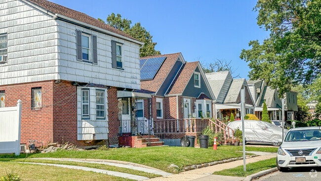 Some homes in Elmont have driveways, but most people park on the street.