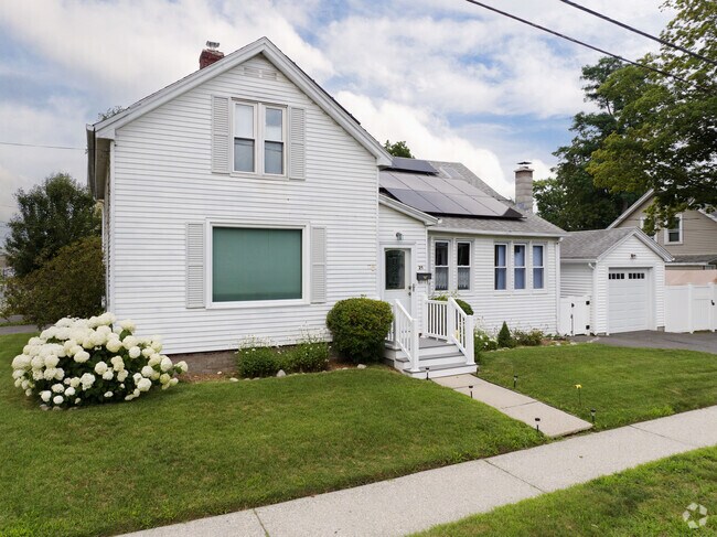 This colonial in Easthampton has a nice solar update and well kept lawn.