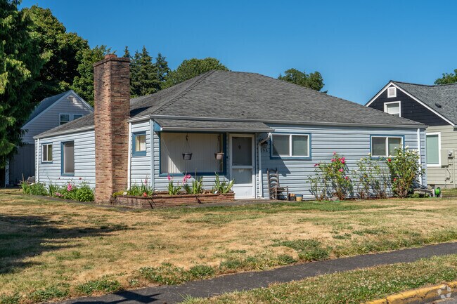 Quaint mid-century homes with well-kept lawns line the peaceful streets of the 3rd Ave.