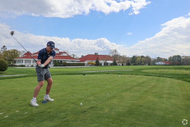 Golfers on New Castle Island enjoy a day on the green at the Wentworth by the Sea Country Club, where stunning views and a challenging course make for a memorable experience.